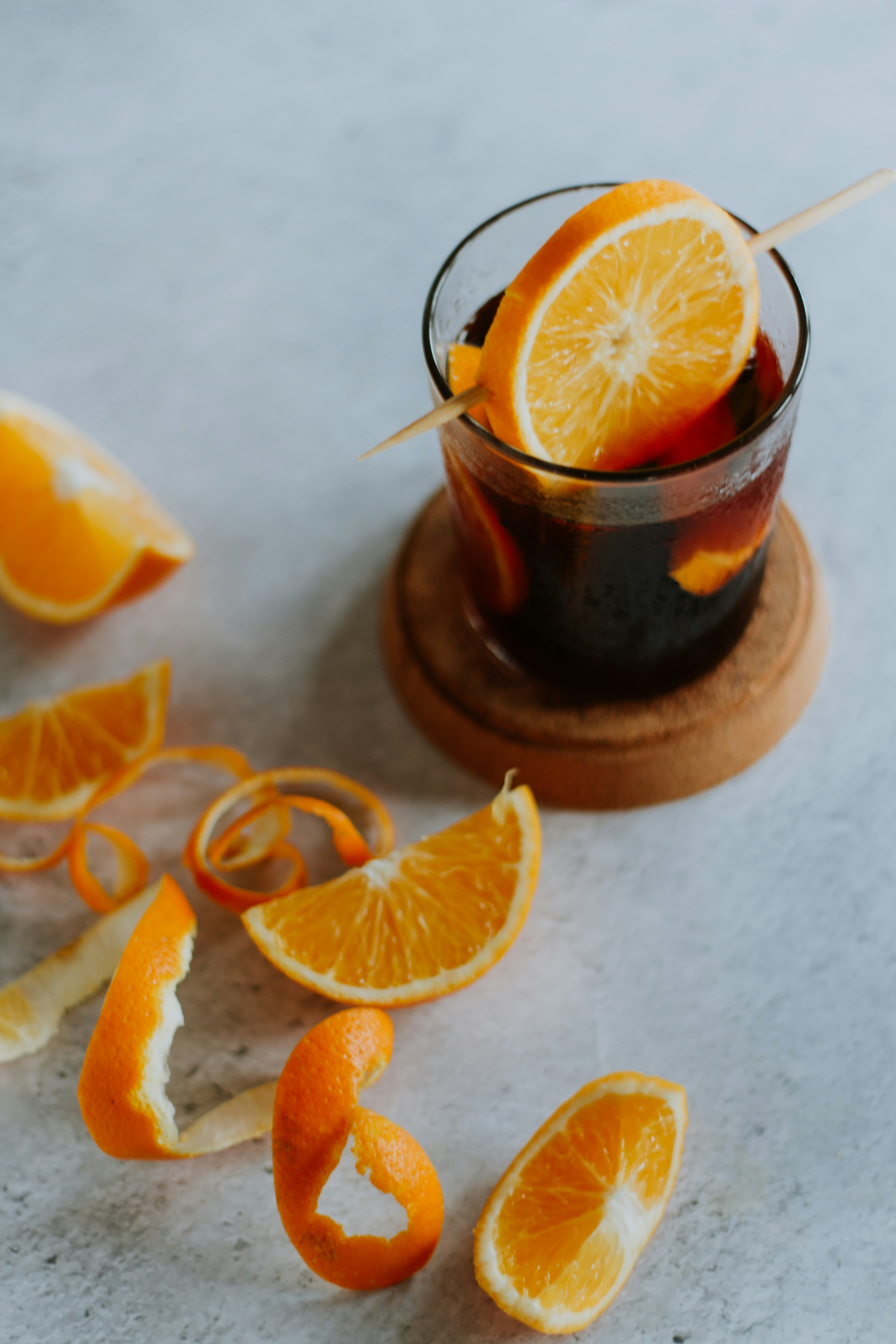 sliced orange fruit on brown wooden round plate